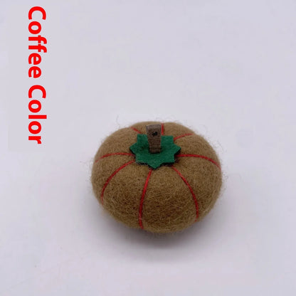 Wool felt pumpkin ornaments in various colours for doll decoration and craft projects.