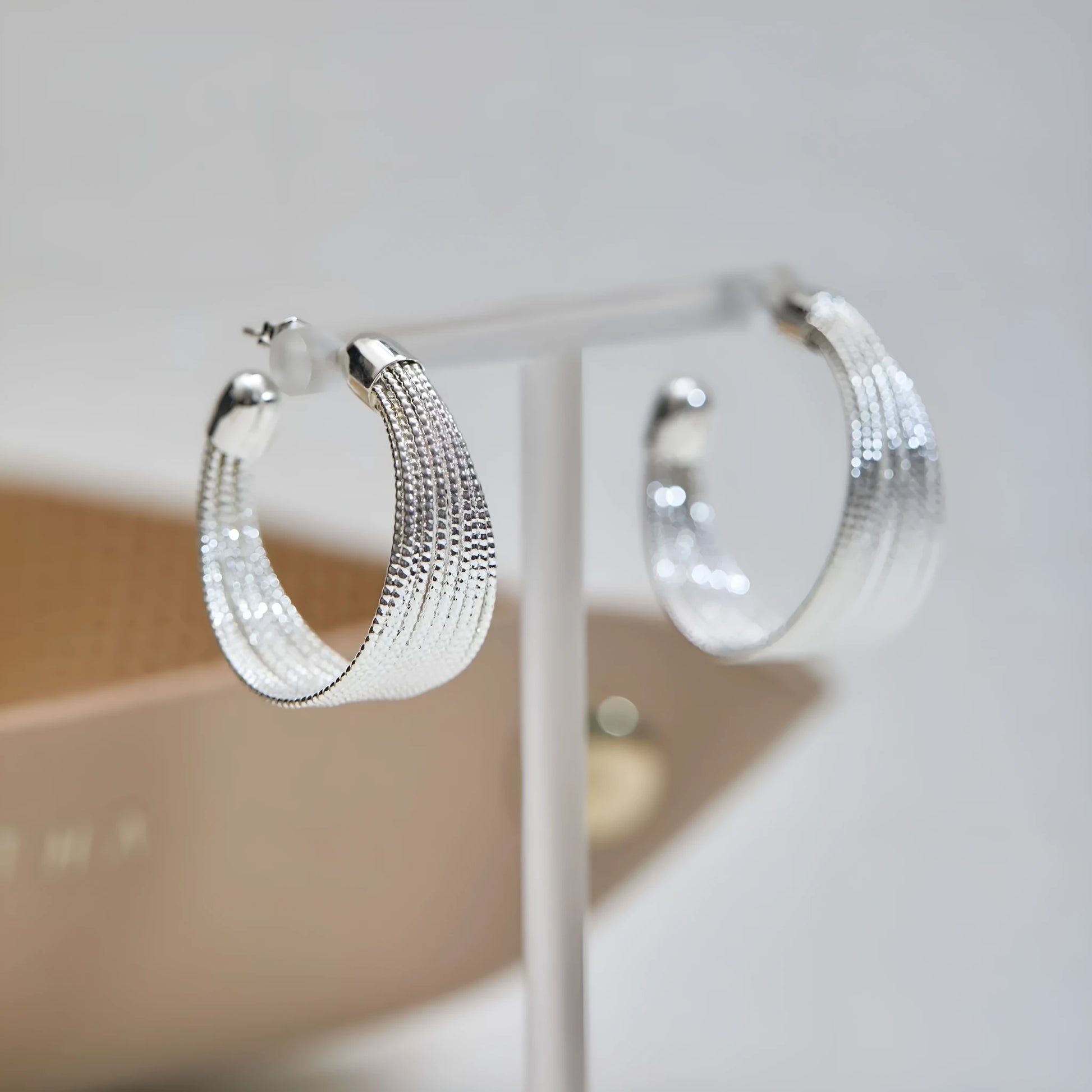 Geometric copper earrings set with gold and silver electroplated finish showing clip and stud options