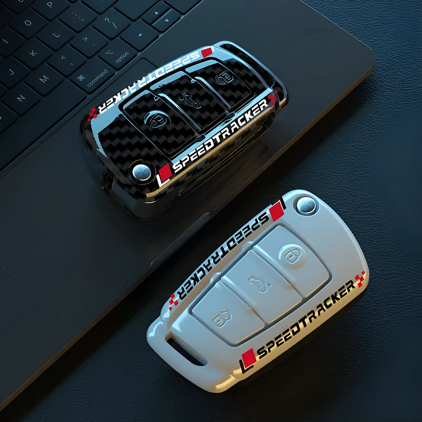 Carbon fibre style car key cover with a mirrored surface element, shown in black and white.