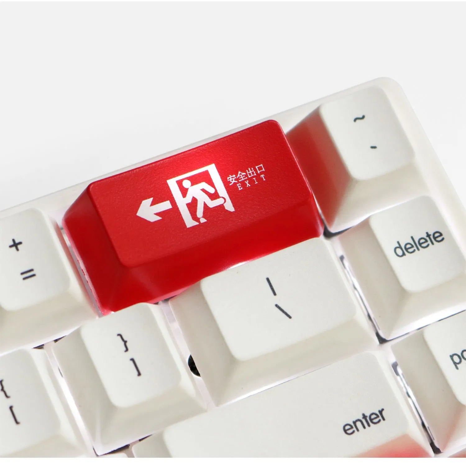 Transparent mechanical keyboard key cap with safety evacuation exit design in red colour
