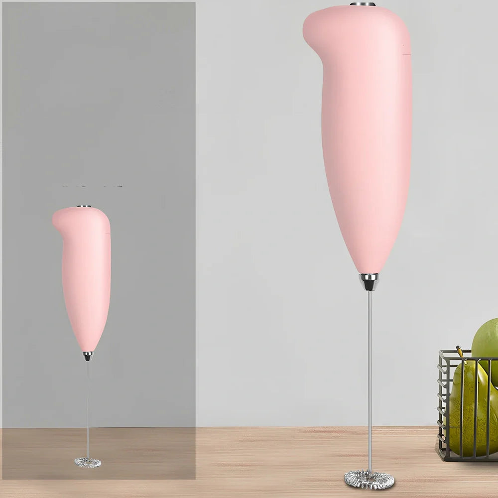 Green electric milk frother measuring 21cm tall with 5cm base creating milk foam