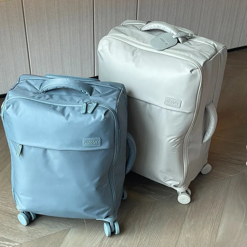 Ultra-light Waterproof Oxford Cloth Suitcase with Universal Wheels: 20-26 inch sizes for easy boarding and durable travel, featuring breathable, antibacterial lining and wear-resistant construction.