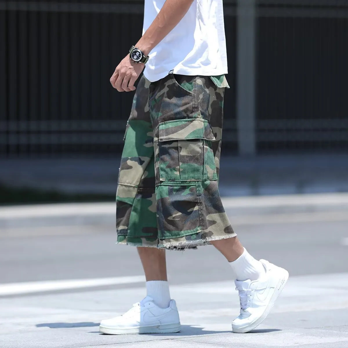 American-style loose-fit camouflage shorts in a cropped length on a neutral background.