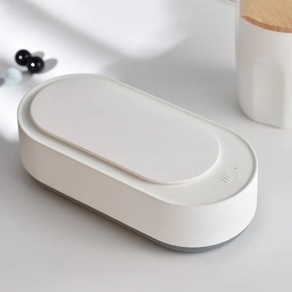 White portable ultrasonic cleaner with stainless steel tank for cleaning jewellery and glasses