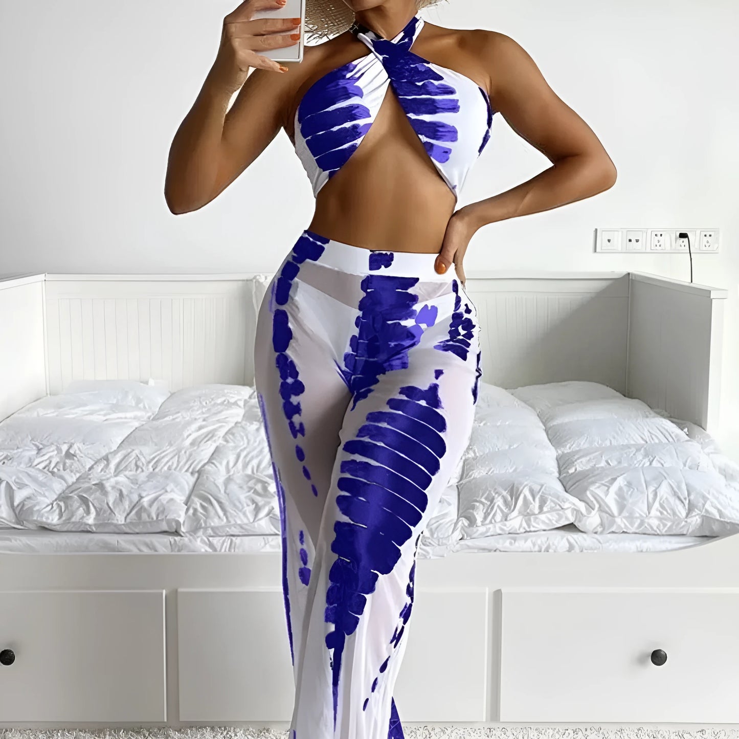 Women's black and blue printed three-piece bikini set with mesh trousers for swimming and fitness.
