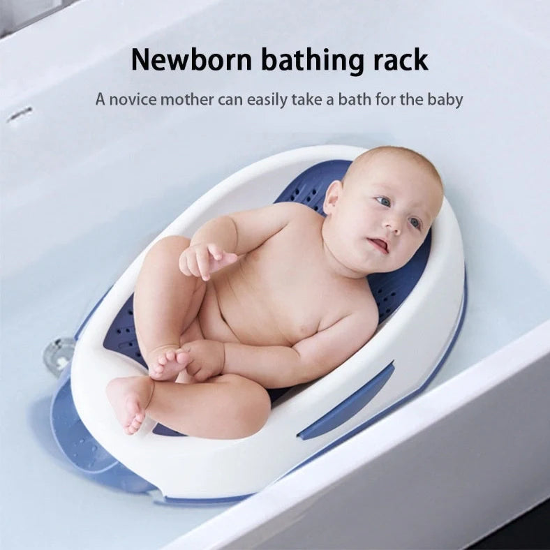 Royal blue baby bath with spine protection design measuring 66cm long with TPE soft edges