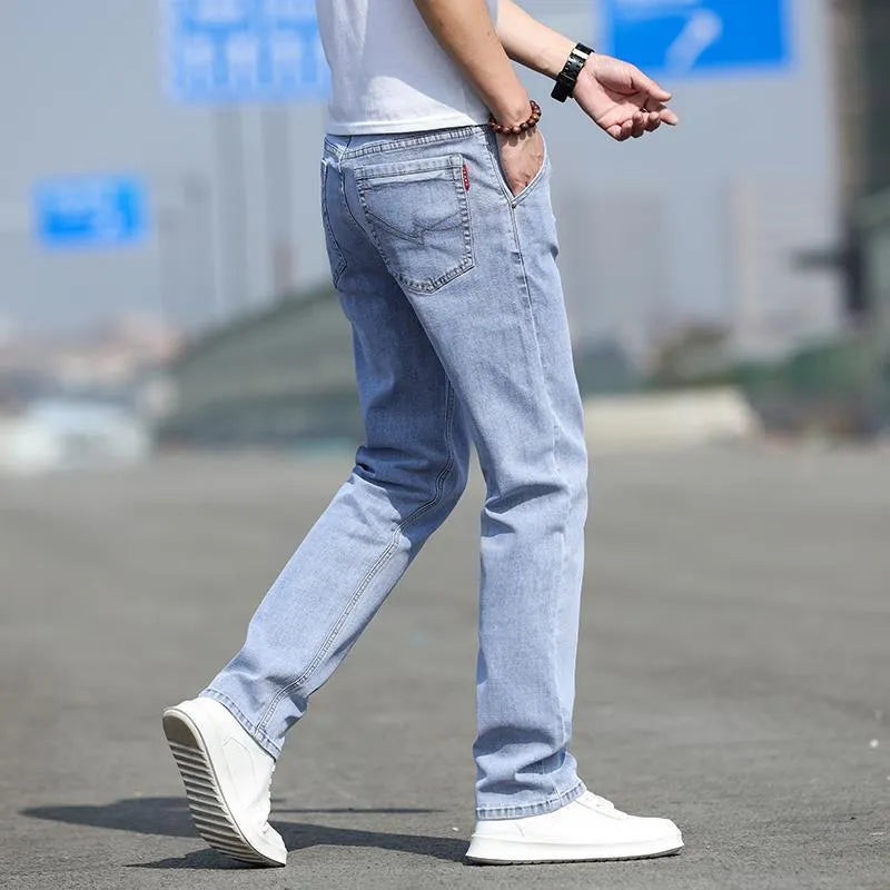 Smoky gray men's straight leg jeans with rabbit fur fabric on a hanger.