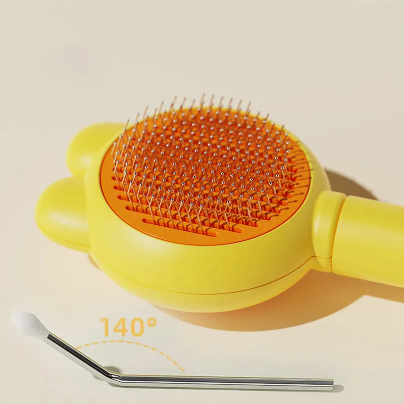 Green self-cleaning pet grooming brush with a release button and rubber-tipped metal pins on a non-slip handle.