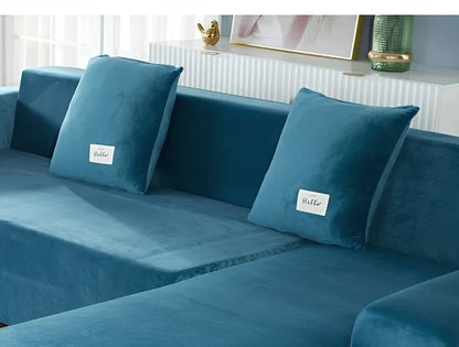 Silver Fox Velvet elastic sofa cover stretched over grey sofa showing fitted appearance