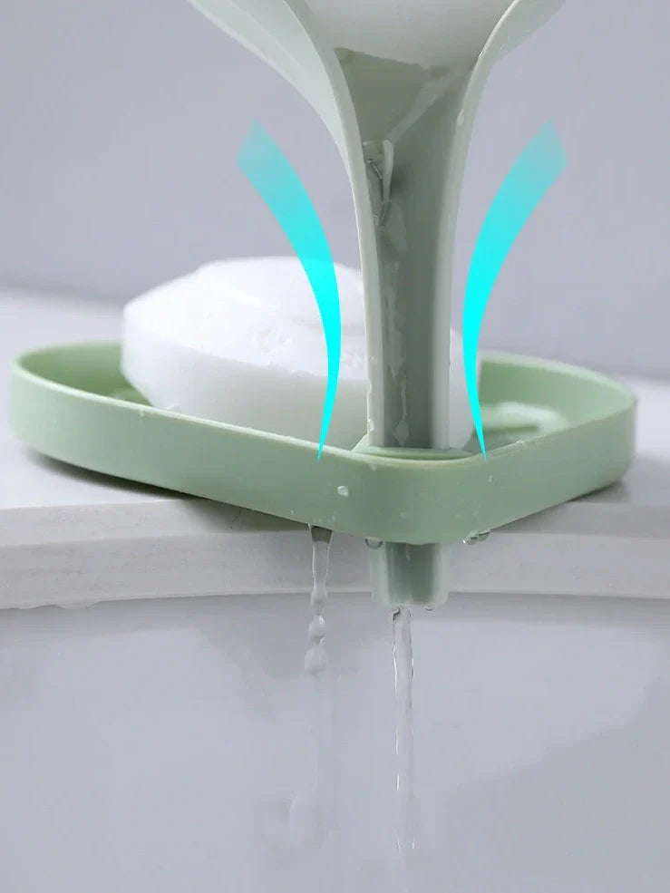 Blue bathroom soap dish with tree texture pattern and drainage channels on white ceramic sink