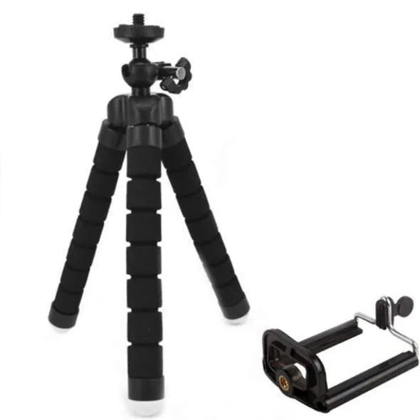 Black flexible octopus tripod stand wrapped around a branch holding a smartphone for angled video capture