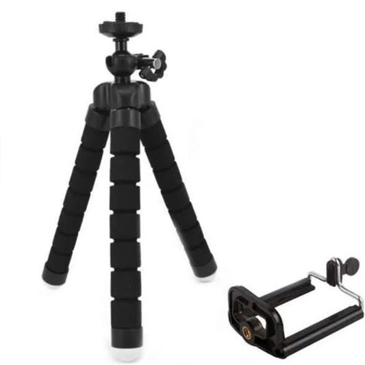 Black flexible octopus tripod stand wrapped around a branch holding a smartphone for angled video capture