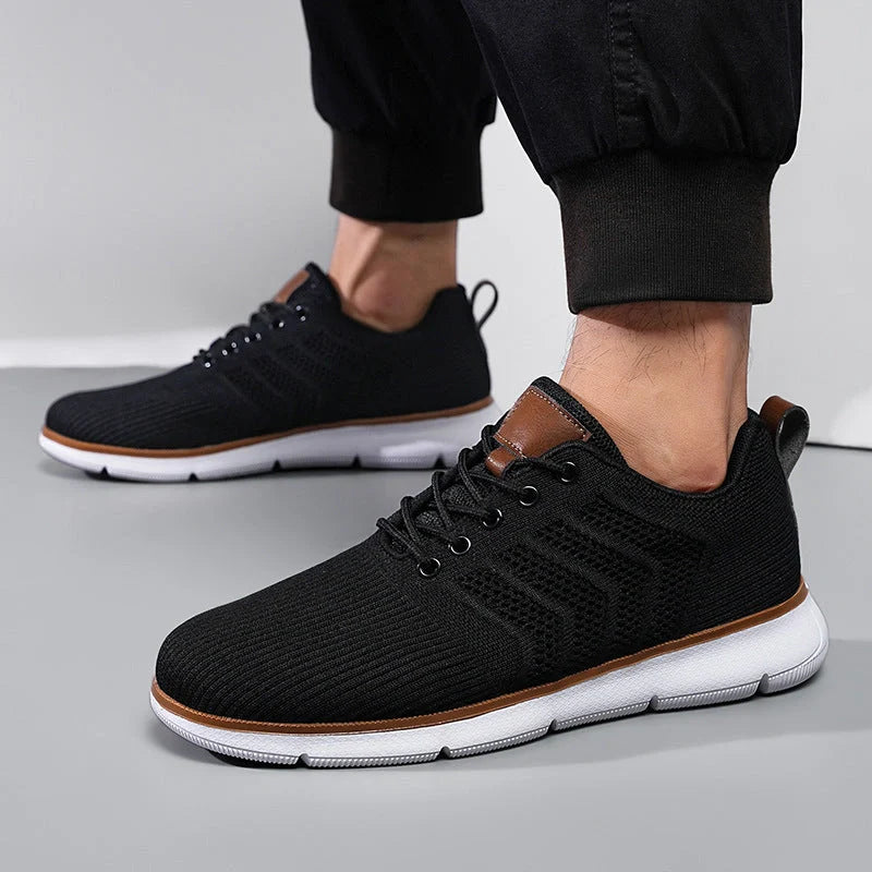 Men's black lace-up mesh sneakers with woven detail for casual and sports wear