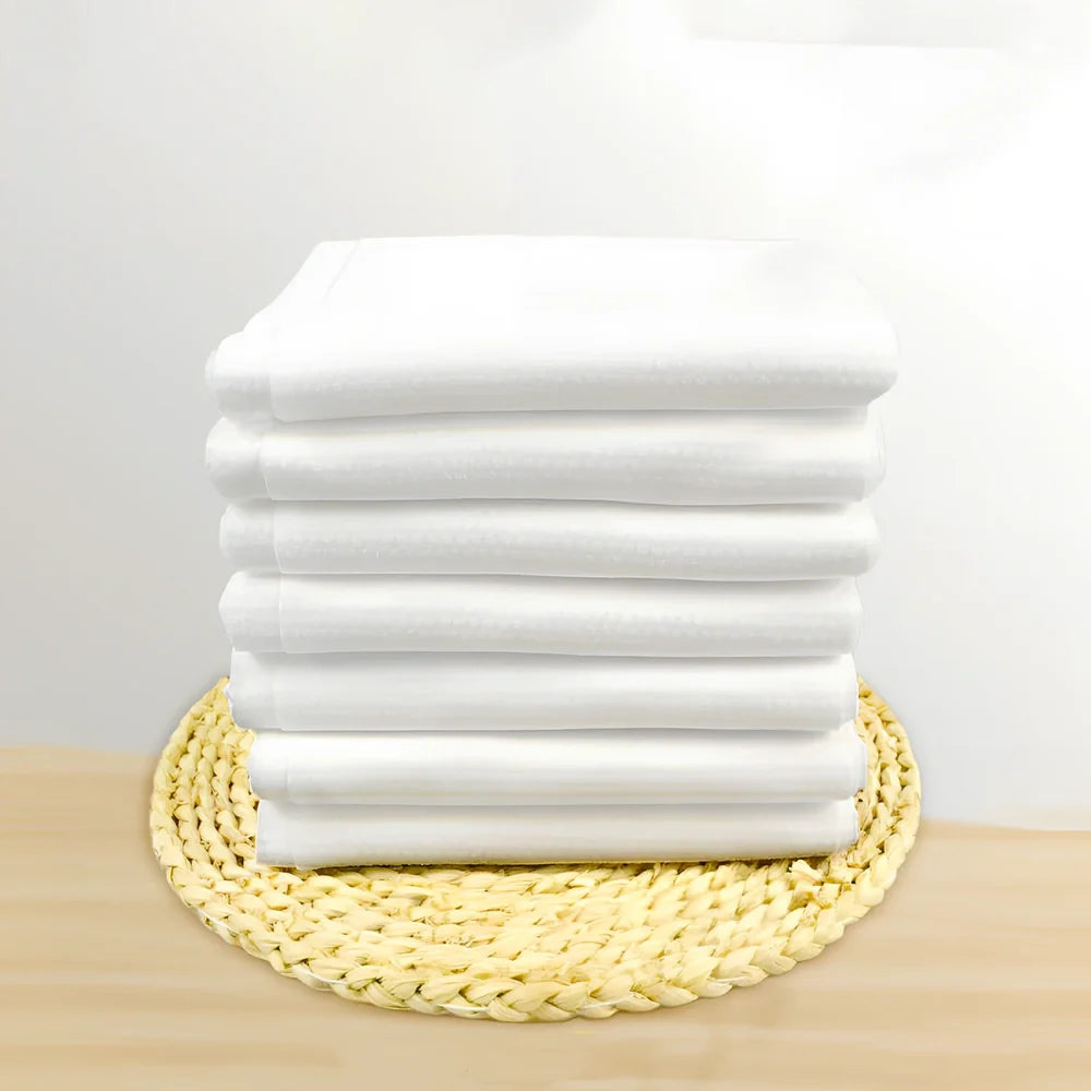 Pack of non-woven disposable bath towels 65x135cm with pearl pattern for absorbent drying