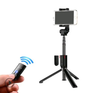Black aluminium Bluetooth selfie stick with tripod legs extended, holding a mobile phone.