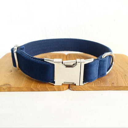 A stylish dark blue velvet pet collar with a matching bow tie accessory, perfect for dressing up your dog