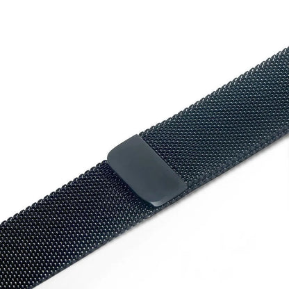 Stainless steel metal link strap for Apple Watch on a wrist, showing deployment clasp and polished finish