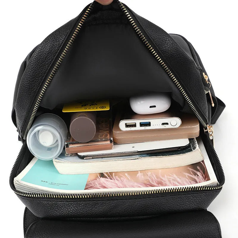 Casual black PU leather women's backpack with a three-dimensional front pocket and street style design.