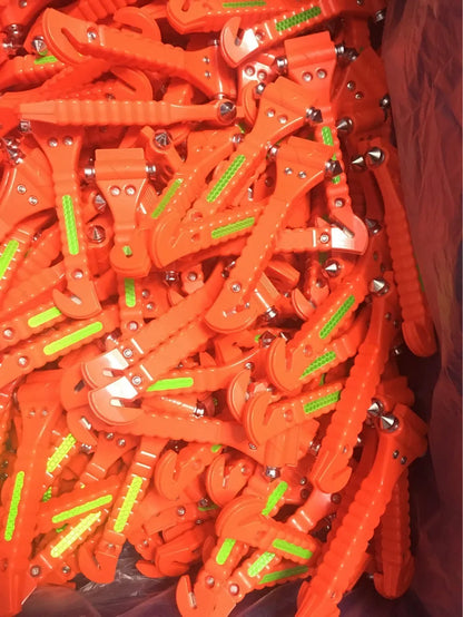 Red car emergency hammer with window breaker and seatbelt cutter tool