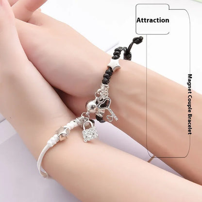 Magnetic suction couple bracelet pair in alloy with an electroplated finish, showing example designs like a crown and love lock.