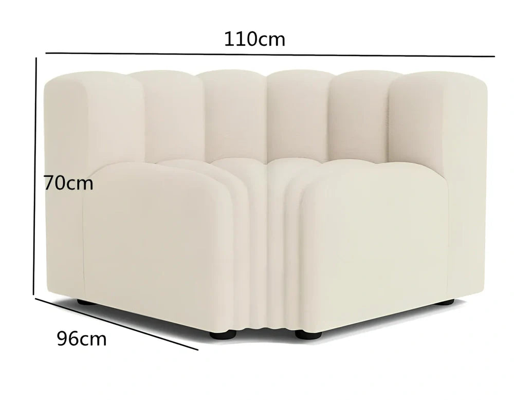 Off-white curved modular sofa with fleece fabric in corner configuration showing multiple connected pieces