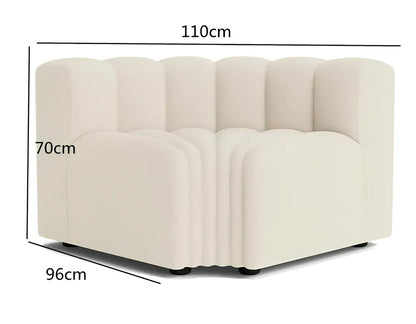 Off-white curved modular sofa with fleece fabric in corner configuration showing multiple connected pieces