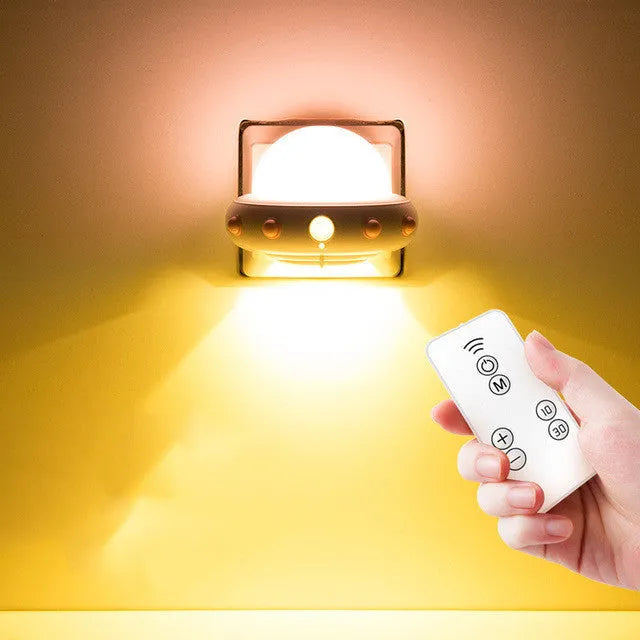 Remote control UFO bedside night light in blue, pink, or white colours with compact 105mm x 76mm dimensions
