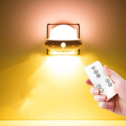 Remote control UFO bedside night light in blue, pink, or white colours with compact 105mm x 76mm dimensions