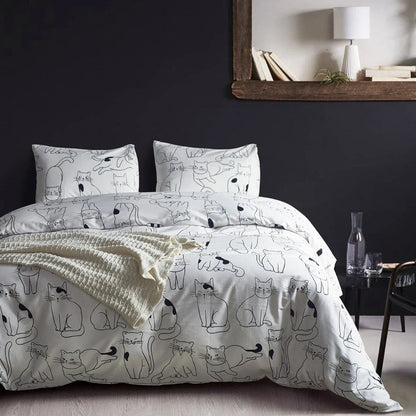 White cotton bedding set with active printed pattern, showing duvet cover, fitted sheet and pillowcases