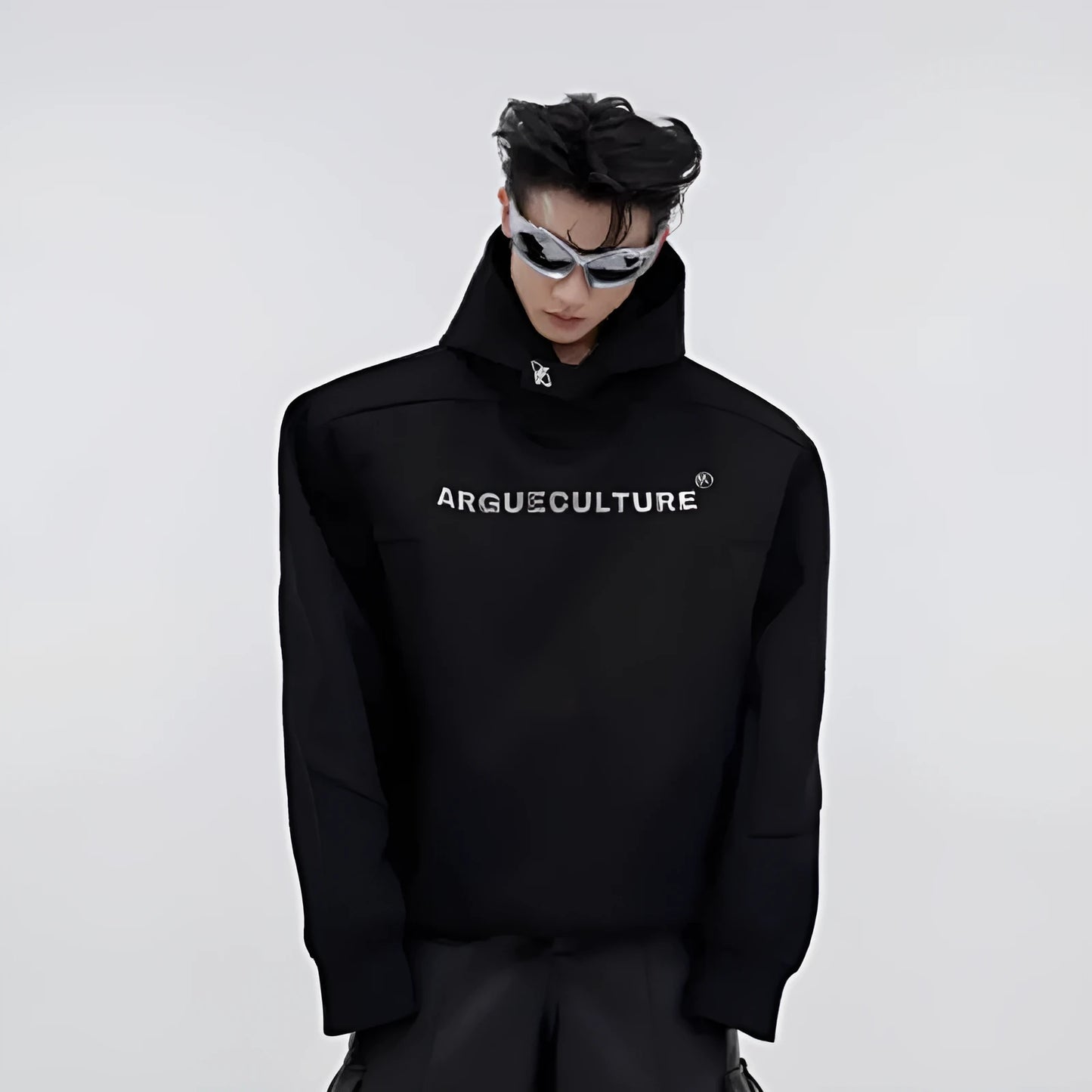 Men's red hooded sweater with heavy shoulder pads and raised metal printing details on front