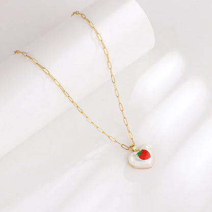 Geometric heart-shaped fruit pendant necklace on an adjustable metal chain