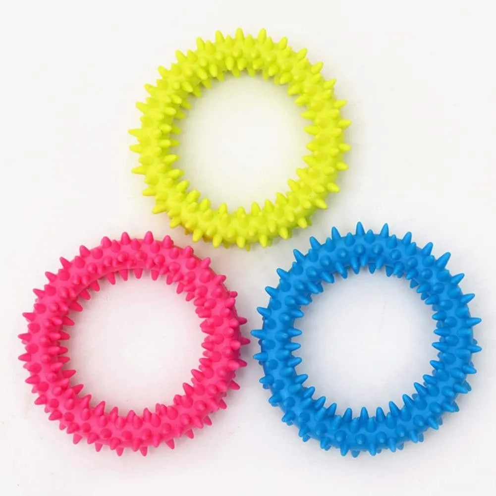 TPR spiky circle ring dog chew toy in assorted colours showing dental cleaning nubs