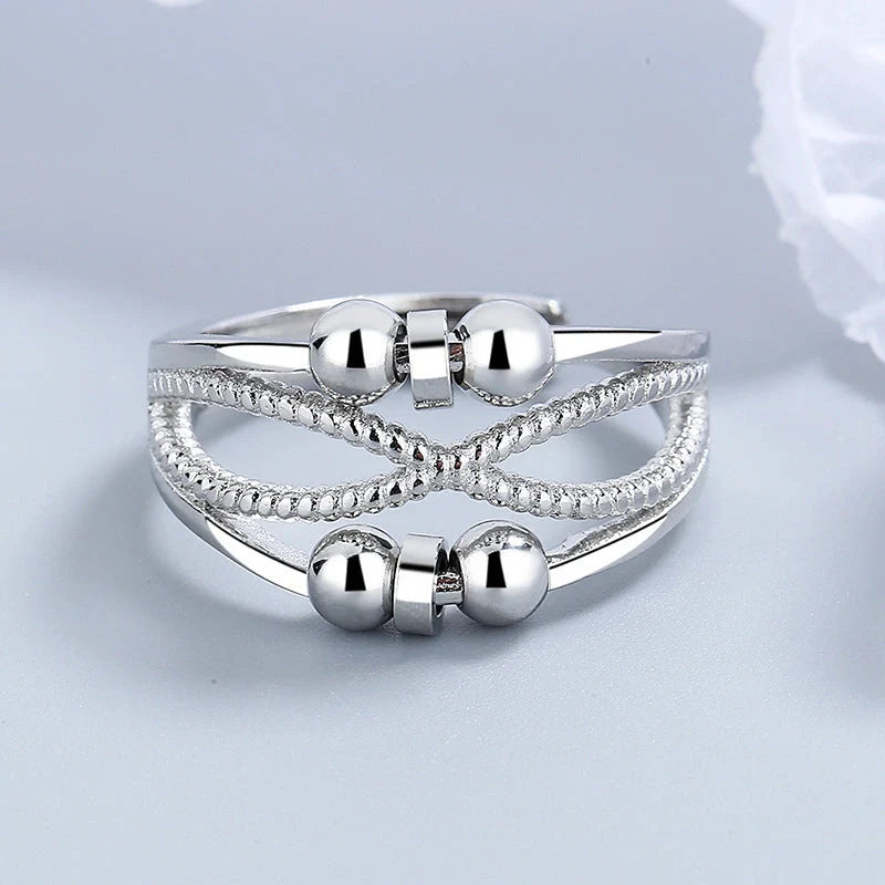 Adjustable rotatable anxiety relief ring for women with open design and platinum finish