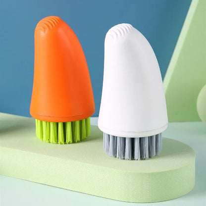 Carrot-shaped kitchen cleaning brush with nylon bristles in orange colour