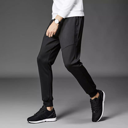 Men's winter sports pants in black and grey, made with South Korean silk fabric for warmth and flexibility