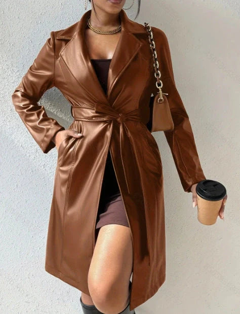 Women's long sleeve faux leather trench coat in various colors with pockets and slim fit design