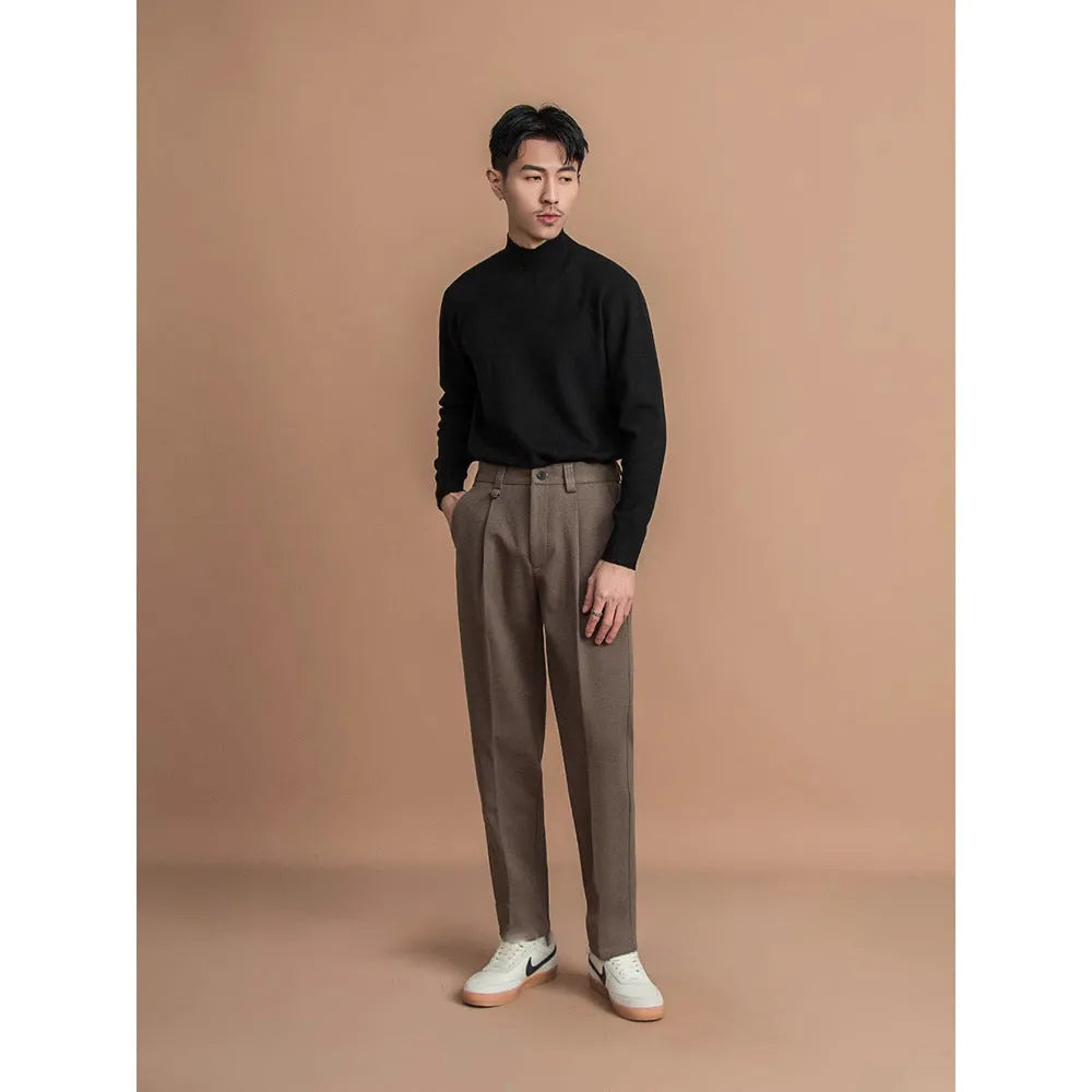 Man wearing straight cut draped polyester casual trousers in dark grey