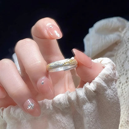 Open mouth silver and gold ring with J14 Xiangyun geometric pattern on a white copper band.