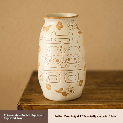 Hand-painted Chinese ceramic vase with carved detail on a desk, shown in Double Happiness colour design.