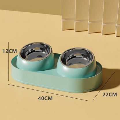 White elevated pet double bowl feeder with tilted food and water bowls on a non-slip stand.