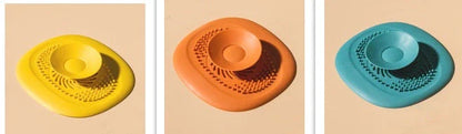 TPR vortex design sink drain cover in twilight orange, quiet blue, mango yellow, and gentian green