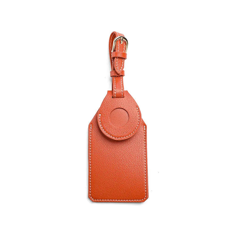 Luggage tag tracker protective cover in black, brown, and orange colours made from PU/PVC material.