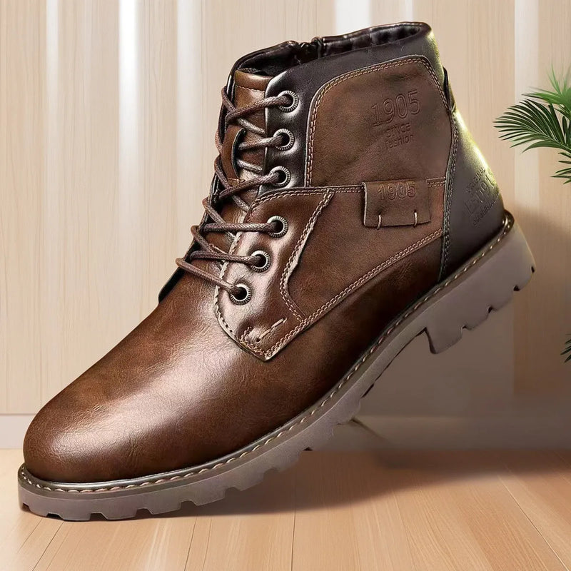 Men's ankle boots with side zip fastening in artificial PU upper and rubber sole, available in brown or black with sizes 39 to 48, ideal for casual wear and easy on-off access
