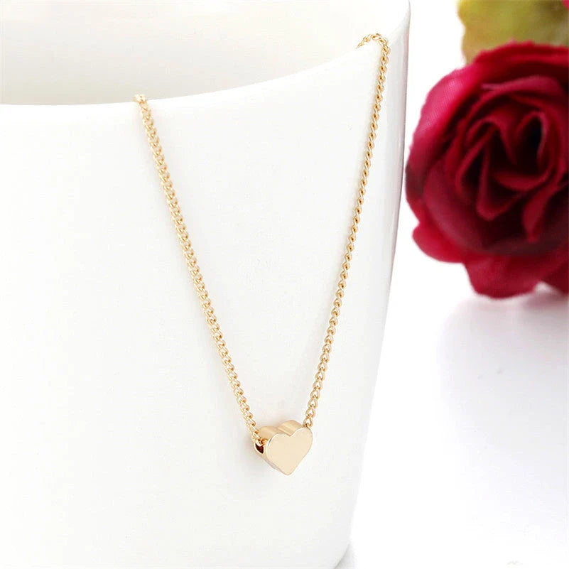 Elegant clavicle necklace with a double-sided love pendant, made of high-quality alloy for a timeless, fashion-forward look.