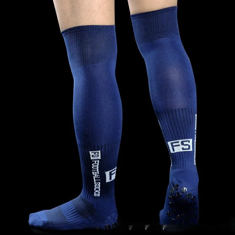 Anti-slip dispensing knee-length football socks in polyester, available in ten colours including black, white, red, and blue.