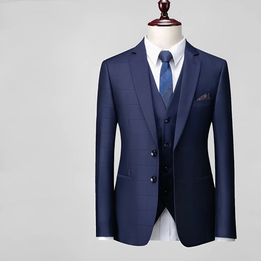 Men's navy blue slim fit three-piece suit with waistcoat on a hanger
