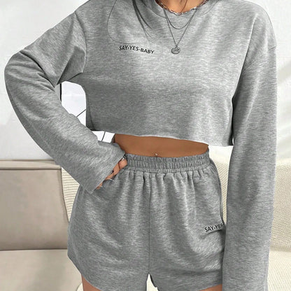 Grey women's long-sleeved T-shirt and shorts polyester set laid flat