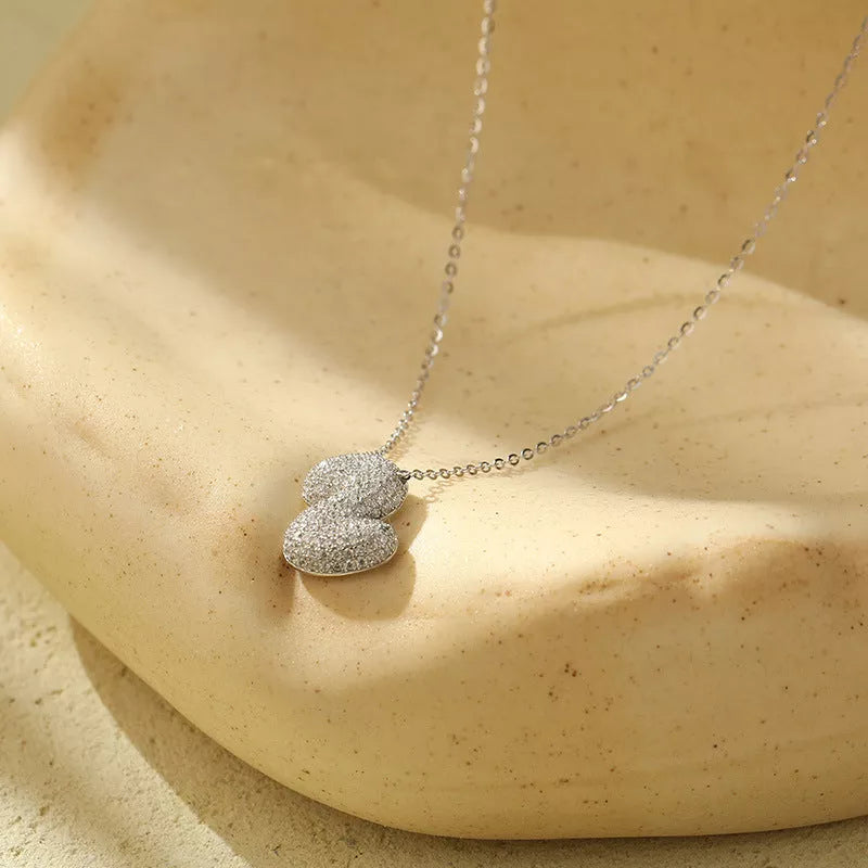 Stainless steel initial pendant necklace with zircon accents, personalized with your choice of letter.