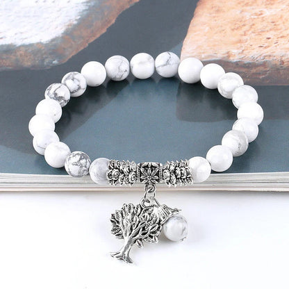 Elegant Vintage Frosted White Pine Bead Bracelet on a wooden background