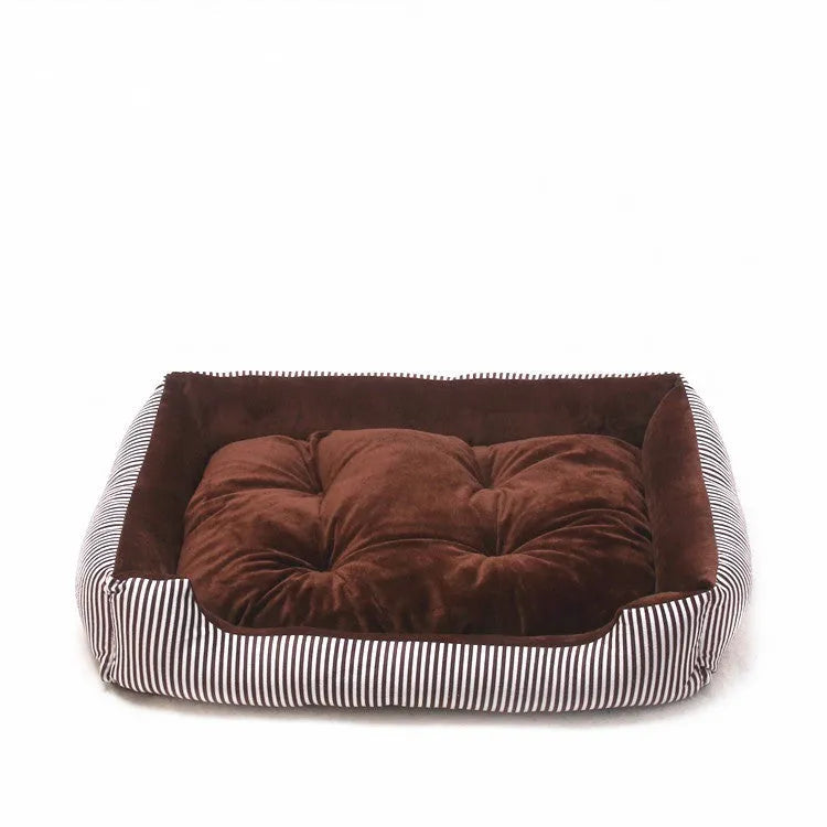 Oval cloth pet bed for dogs or cats in a striped colour pattern, showing its soft cushion shape.